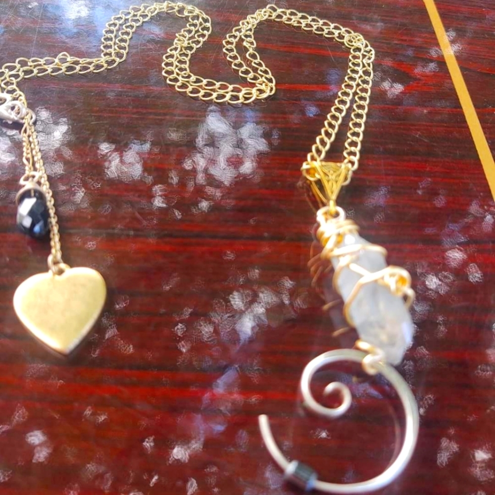 A necklace that I hand crafted from a blue Angel Aura Crystal... Silver and gold